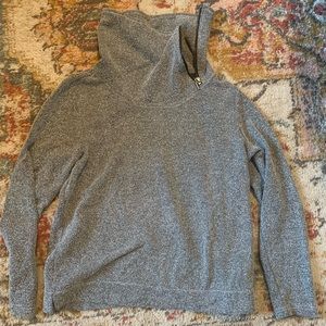Turtle neck sweater with zipper on neck. Herringbone pattern.